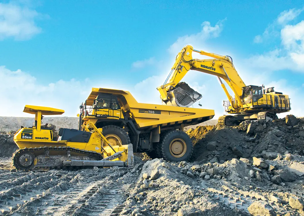 Excavator and haul truck performing major earthmoving work